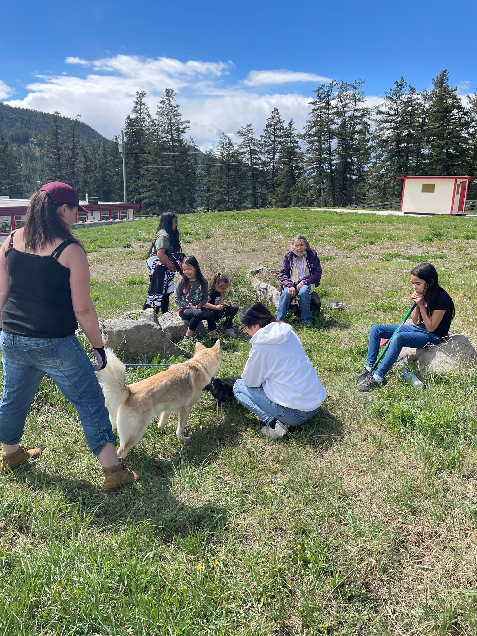 Dog%20Creek%20Students%20Outside%20with%20Elder.jfif