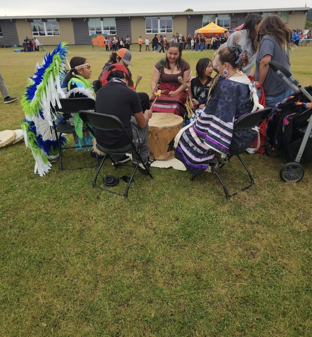 orange shirt drumming Ty Lytton